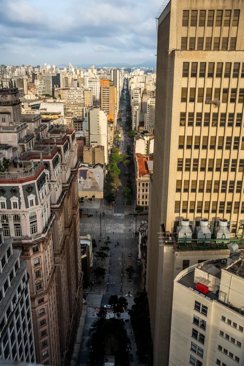 Free A stunning aerial view of an urban cityscape featuring prominent skyscrapers and a bustling avenue. Stock Photo