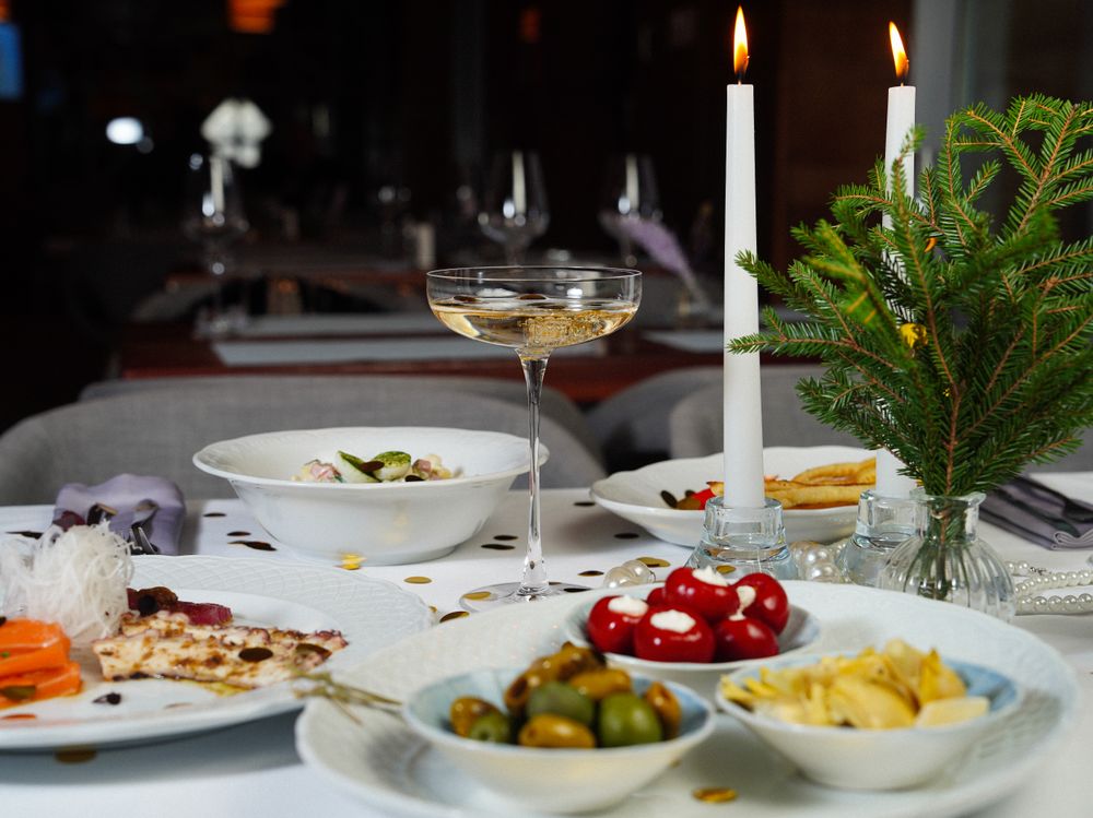 Elegant candlelit dinner table with wine