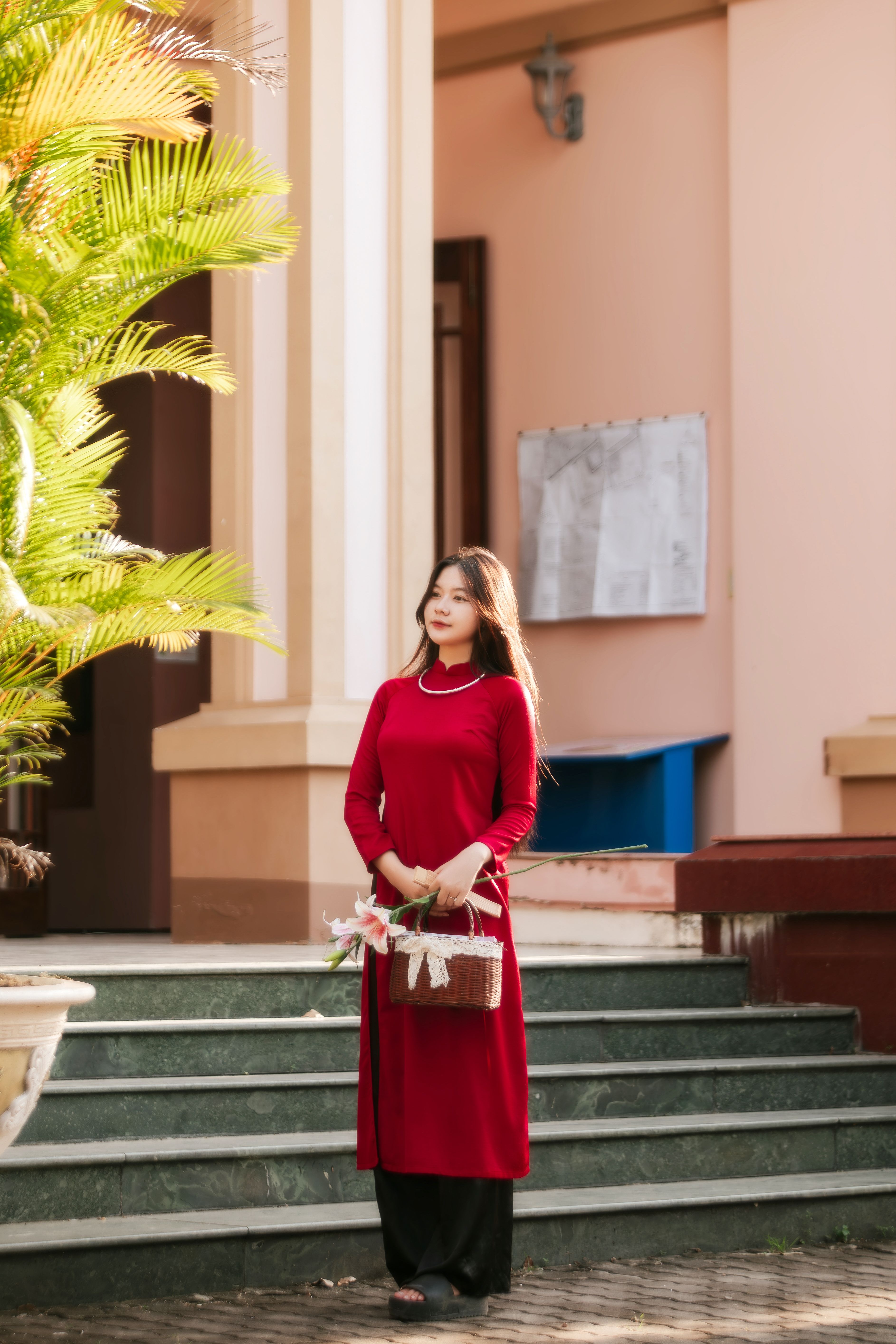 Elegant Woman in Red Dress Holding Basket Outdoors · Free Stock Photo