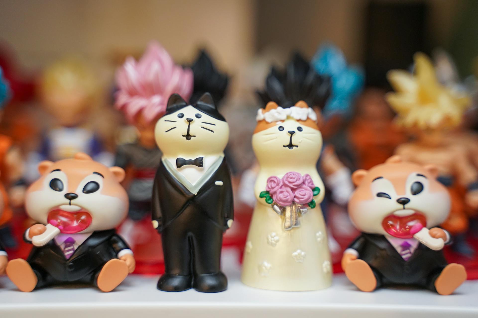 Collection of adorable animal figurines dressed as bride and groom, ideal for weddings or ornament displays.