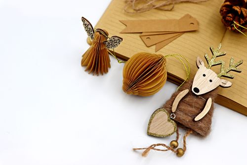Free Stylish recycled paper and wood Christmas decorations for an eco-friendly holiday season. Stock Photo