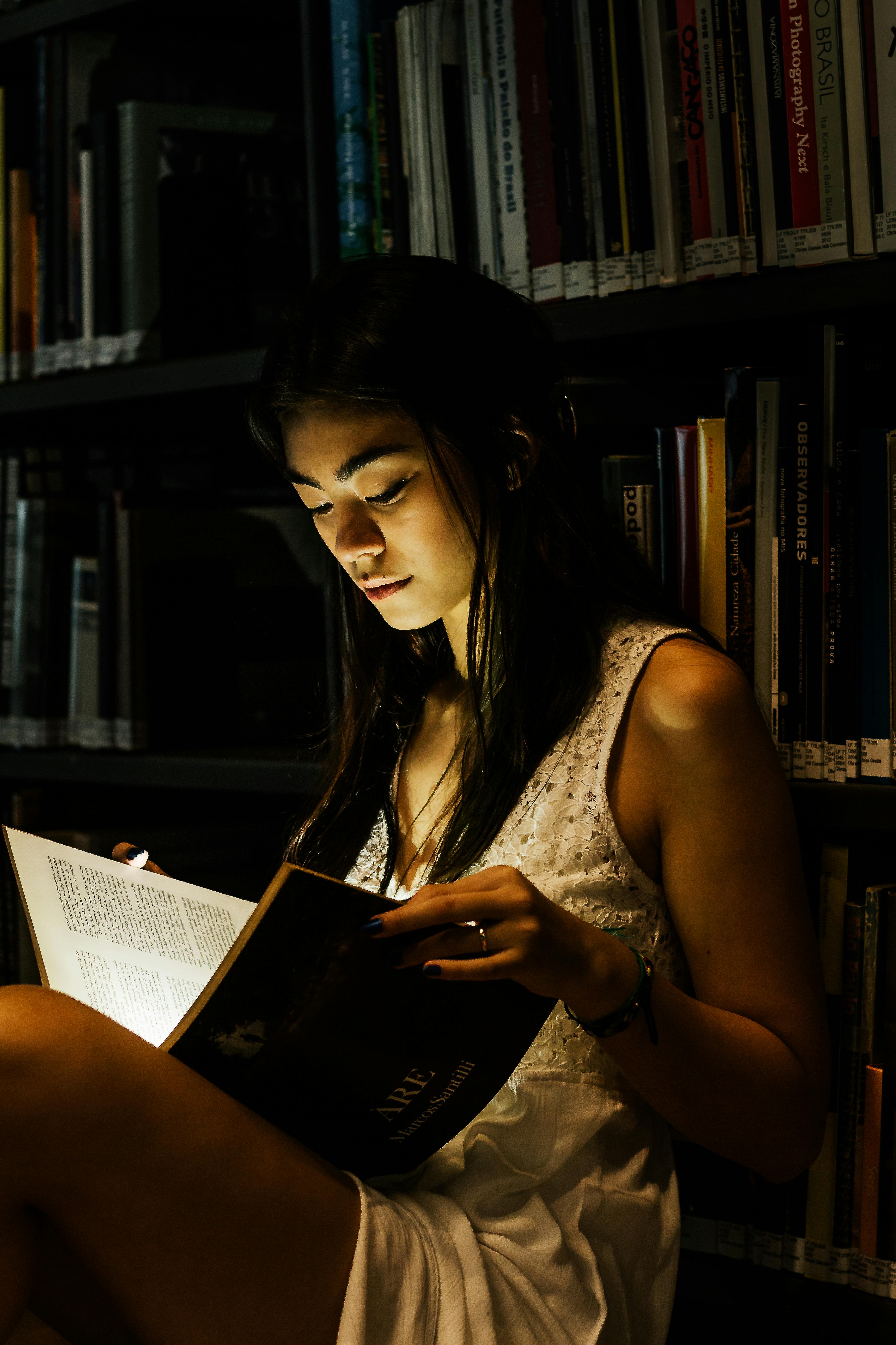 photo of woman reading book