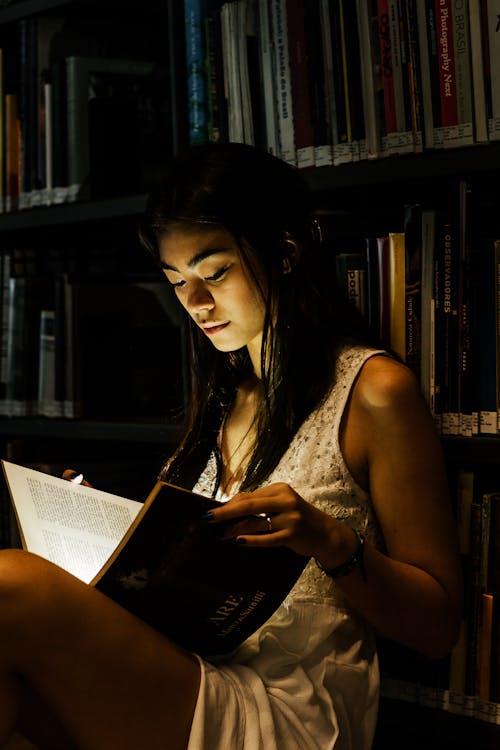 Photo Of Woman Reading Book