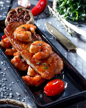 Delicious grilled shrimp and fish served with aromatic herbs and spices for a gourmet meal experience.
