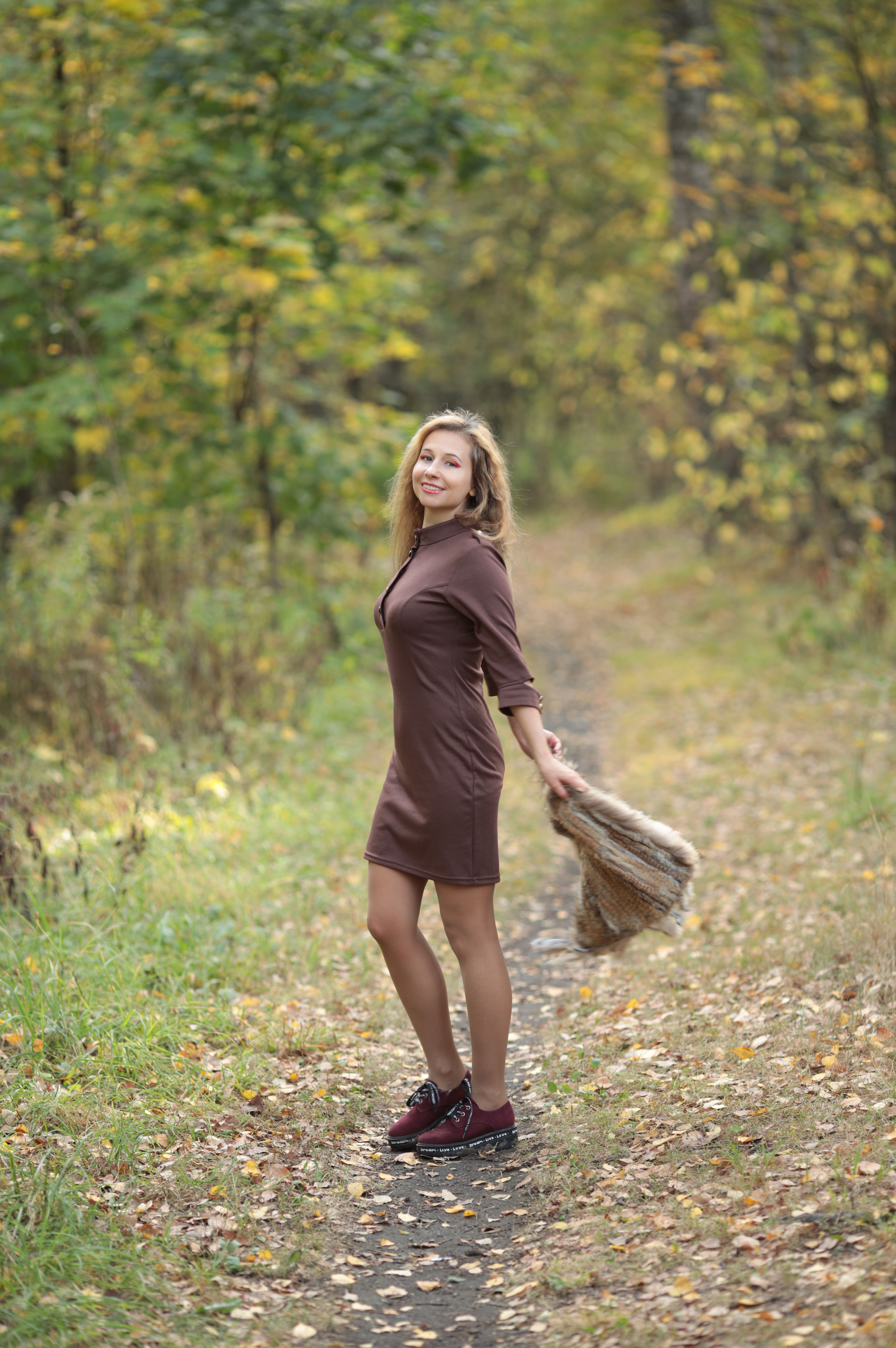 Woman Enjoying a Walk in Autumn Forest · Free Stock Photo