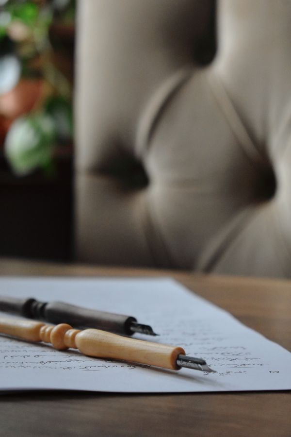 Elegant calligraphy pens on writing desk