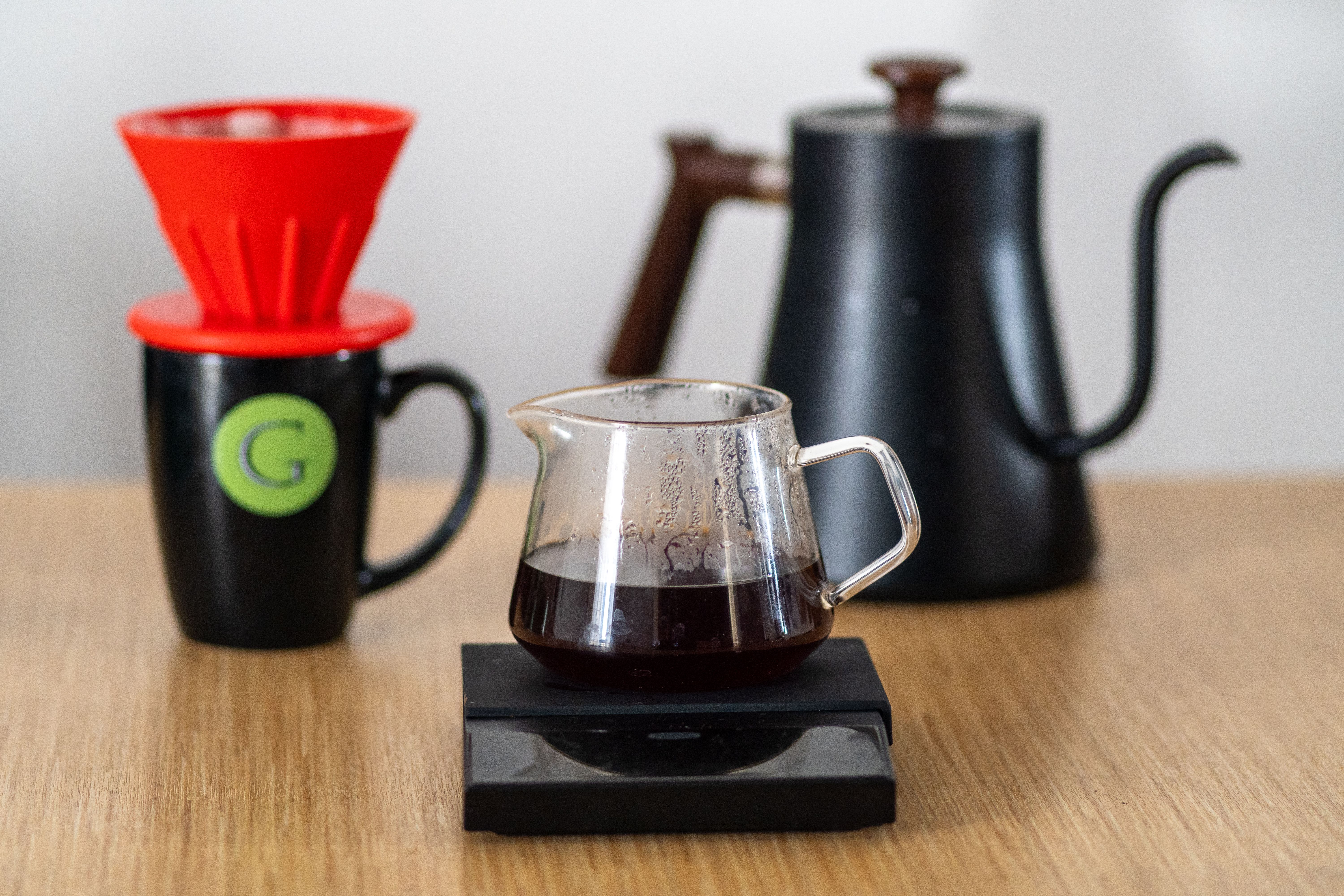 Top view of a pour-over coffee brewing process using a filter dripper set.
