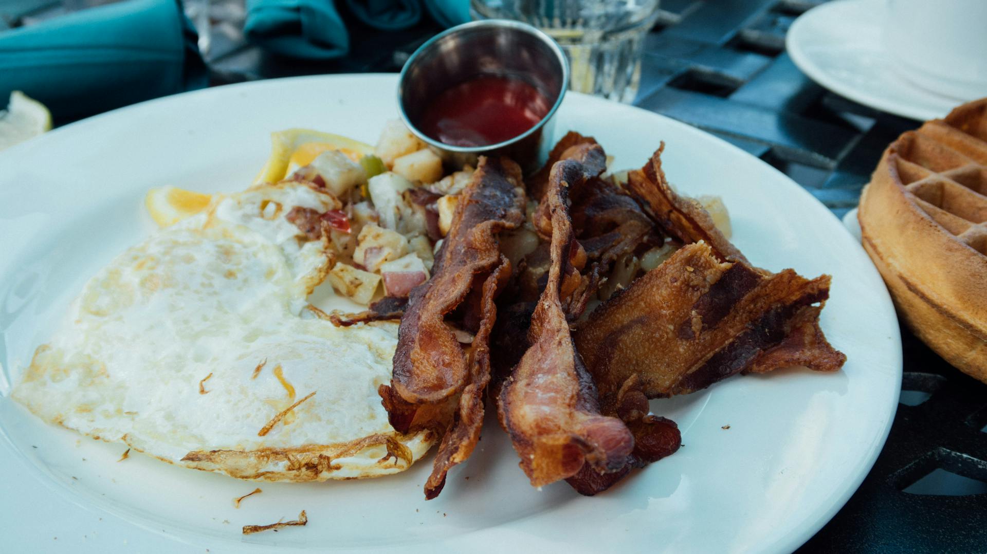 Bacon Strips and Sunny Side-up Egg Dish on Round White Ceramic Plate