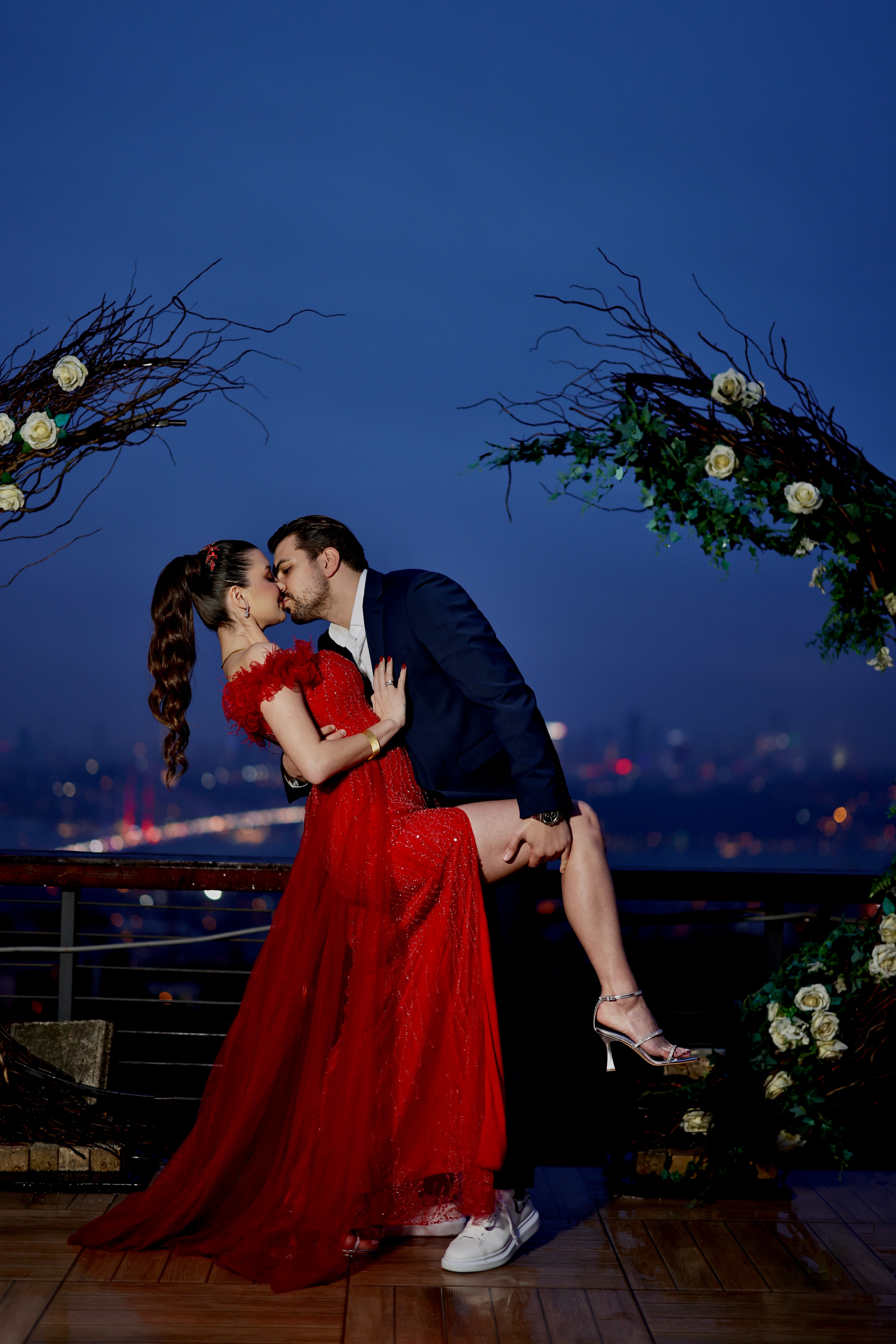 View of Romantic Evening Kiss on a Rooftop Balcony · Free Stock Photo