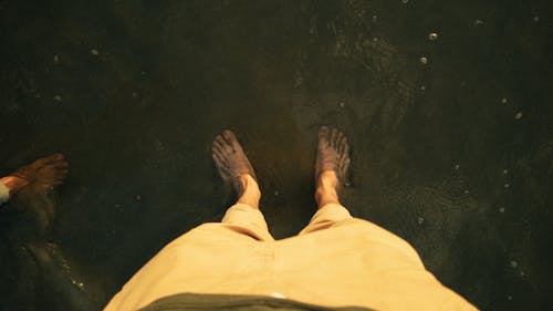 High-Angle Photo of Person's Feet