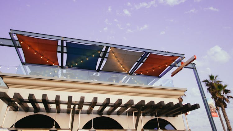 White Painted Building With Multicolored Awning