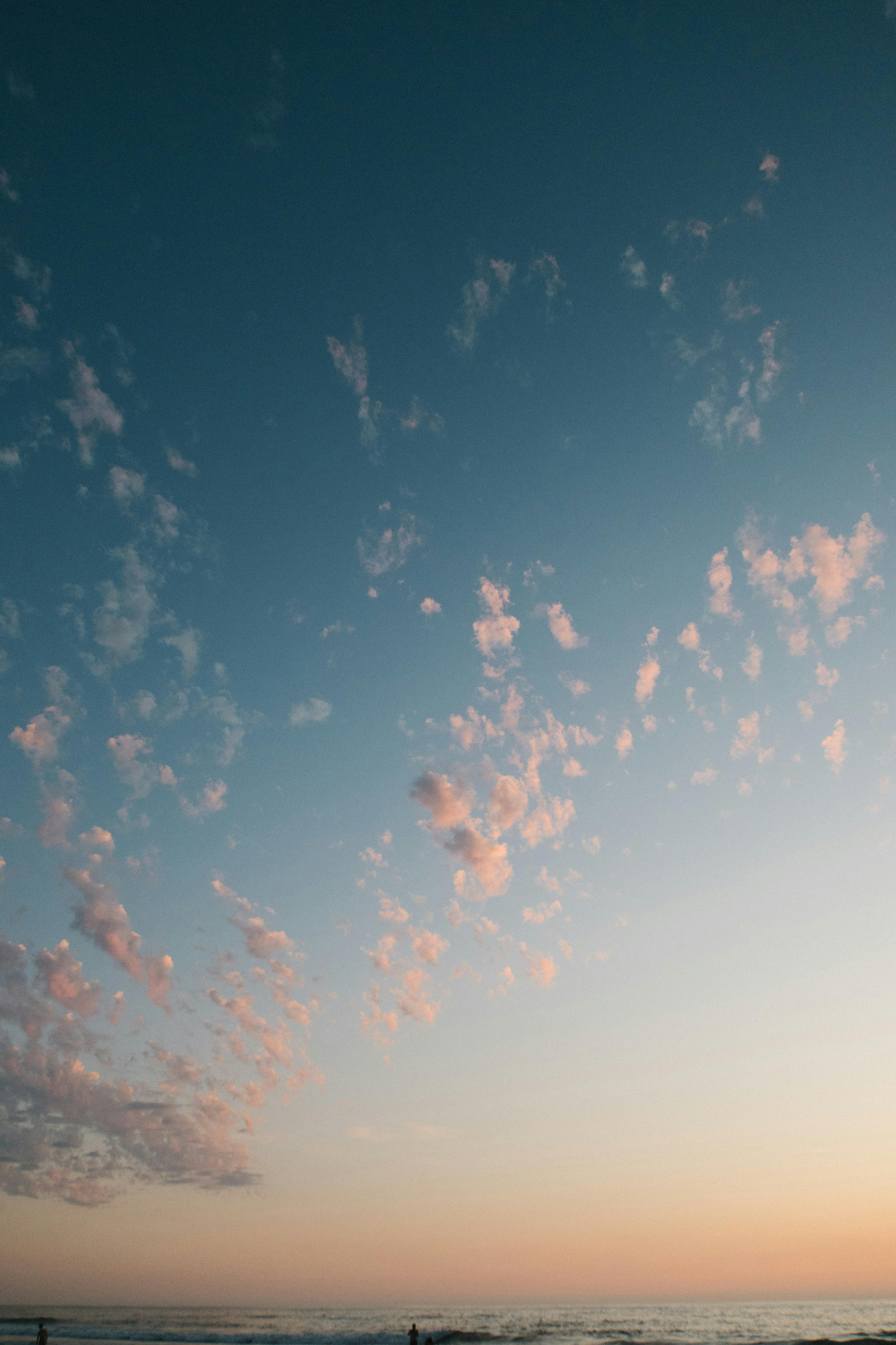 photo of white clouds during golden hour