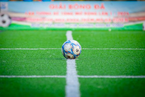Free Close-up of a soccer ball on a green field in Hà Nội, Vietnam. Stock Photo