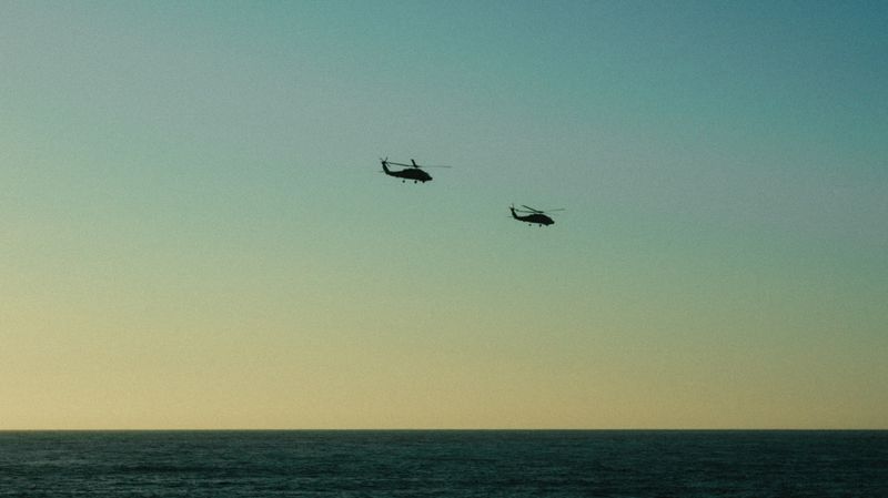 Helicopter flight over the coast