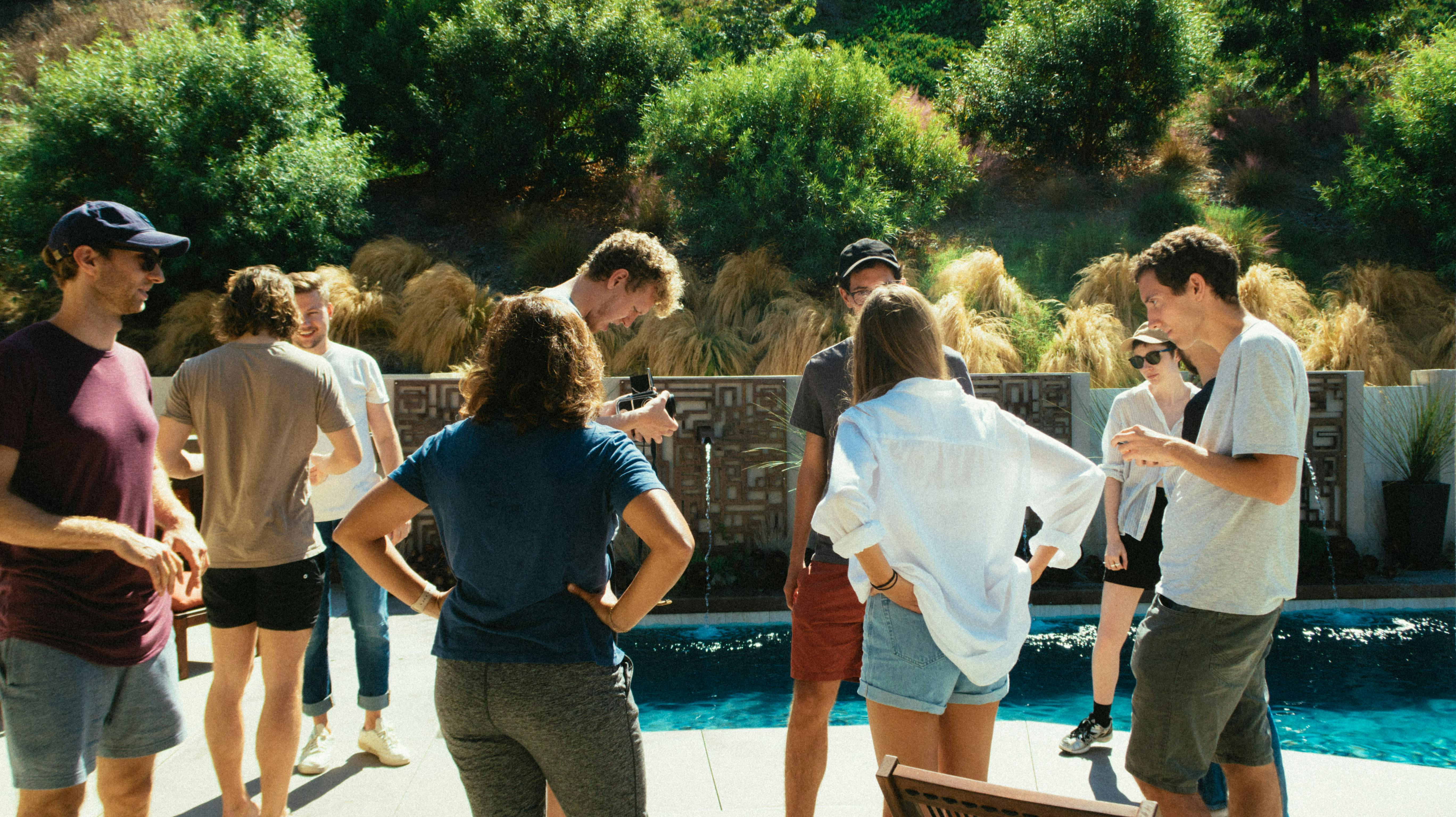 people standing beside pool