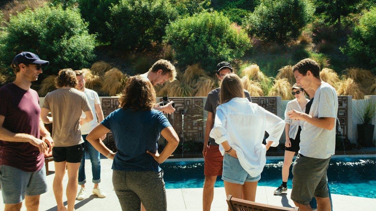 Free People Standing Beside Pool Stock Photo