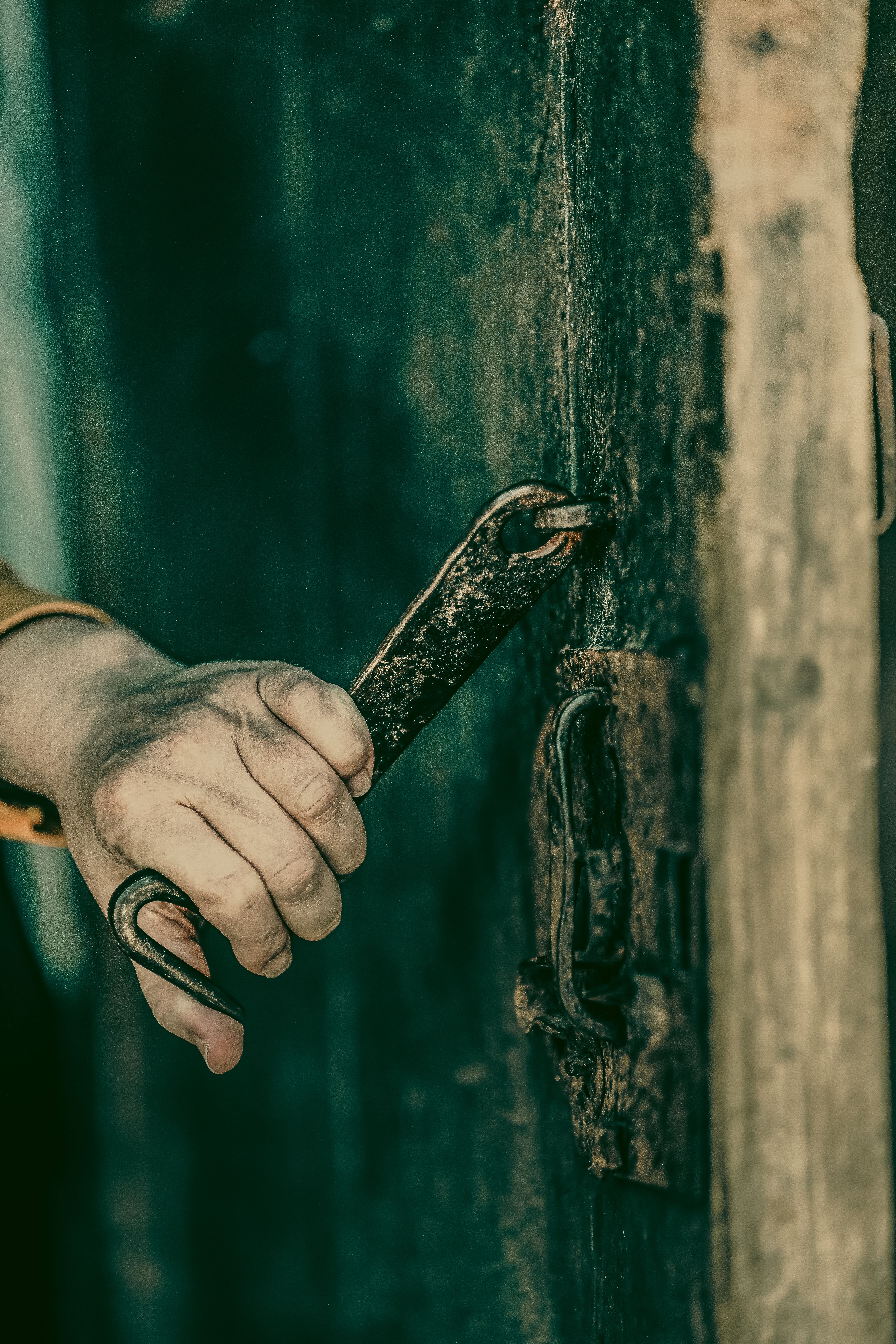 Rustic Hand with Tool Opening Aged Door · Free Stock Photo