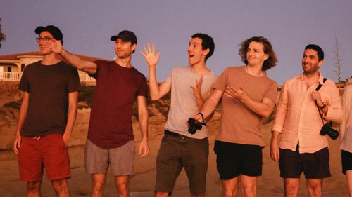 Free A group of young men enjoying a casual photo session outdoors during sunset. Stock Photo