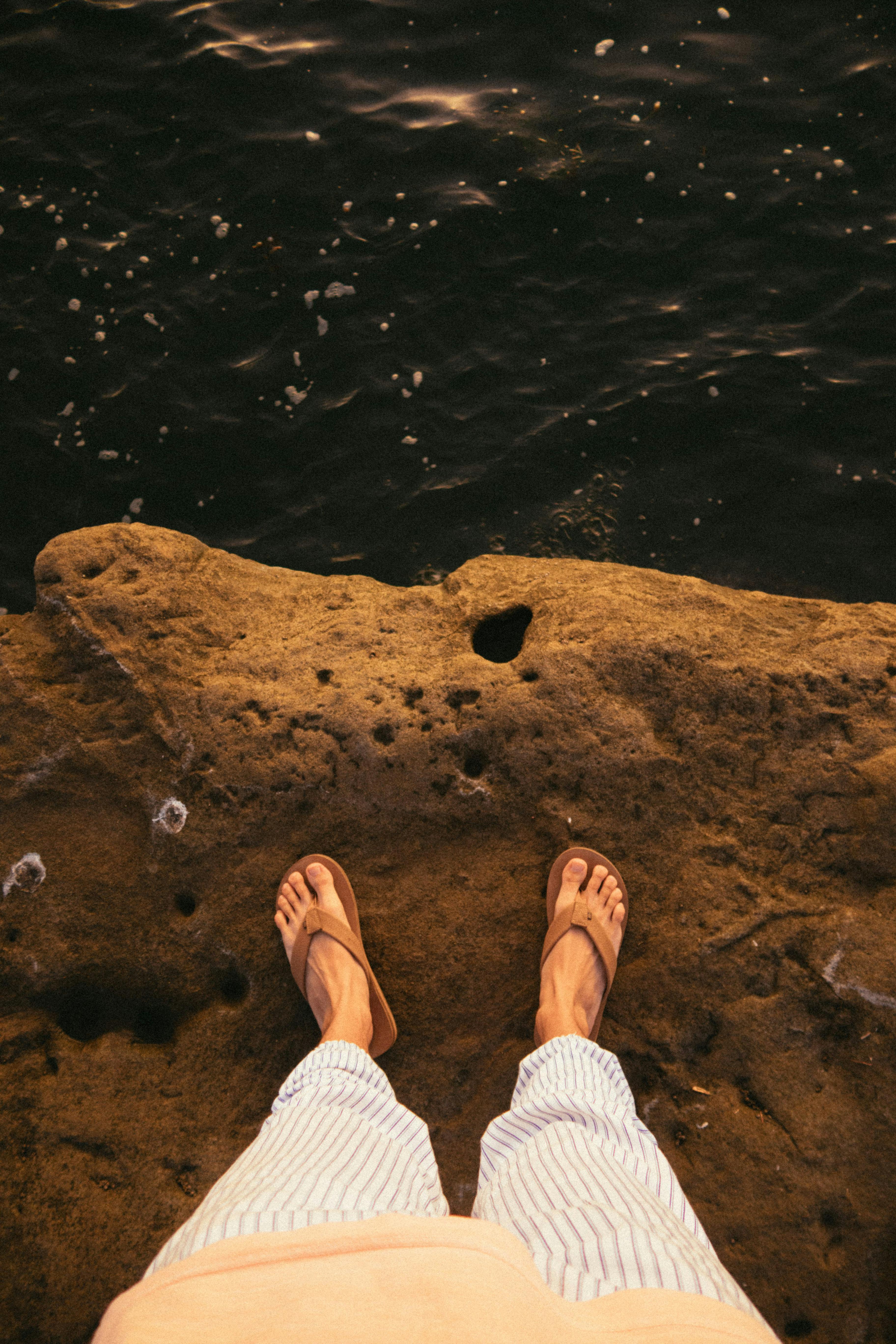 pair of brown flip flops