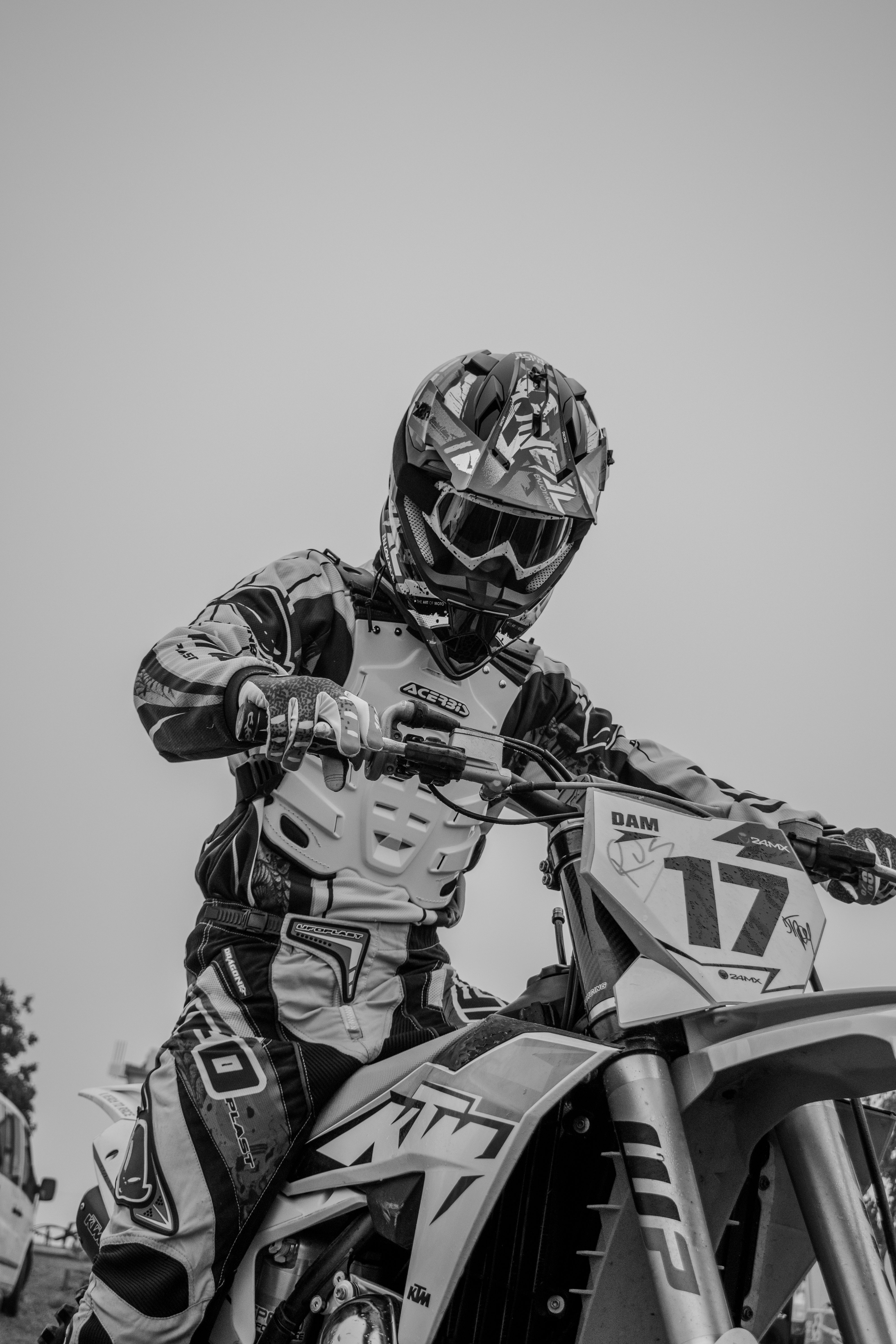 Dynamic Black and White Motocross Racer in Action · Free Stock Photo
