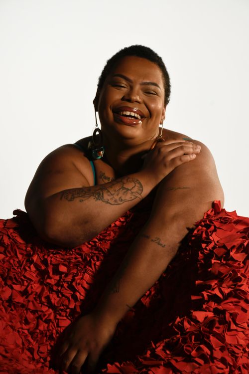 Free Captivating portrait of a joyful plus-size woman in Rio de Janeiro, celebrating self-love and confidence. Stock Photo