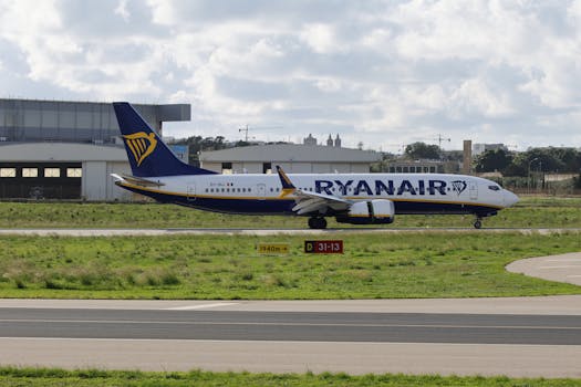 A Ryanair plane positioned on the airport runway, ready for departure.
