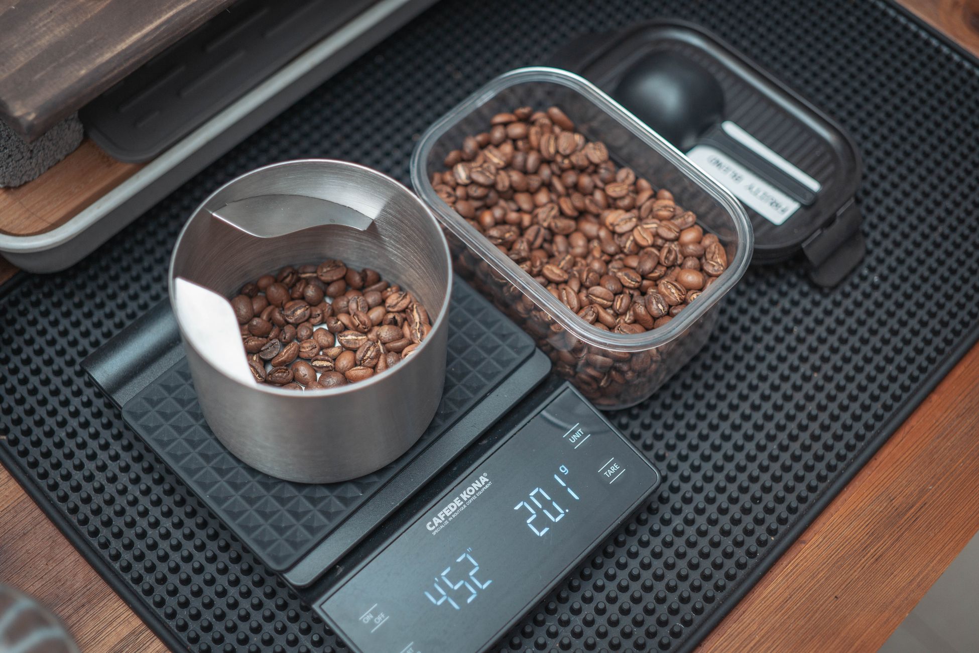 Close-up of coffee beans on a digital kitchen scale, perfect for precision brewing.