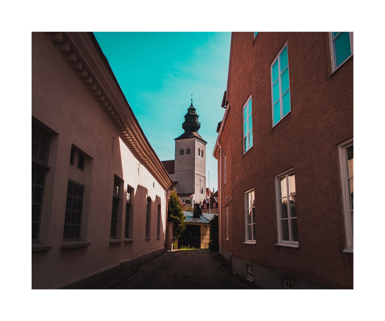 Quiet alleyway with view of Saint Mary's Cathedral in Visby, Gotland. — photo by Aleks Magnusson / Pexels