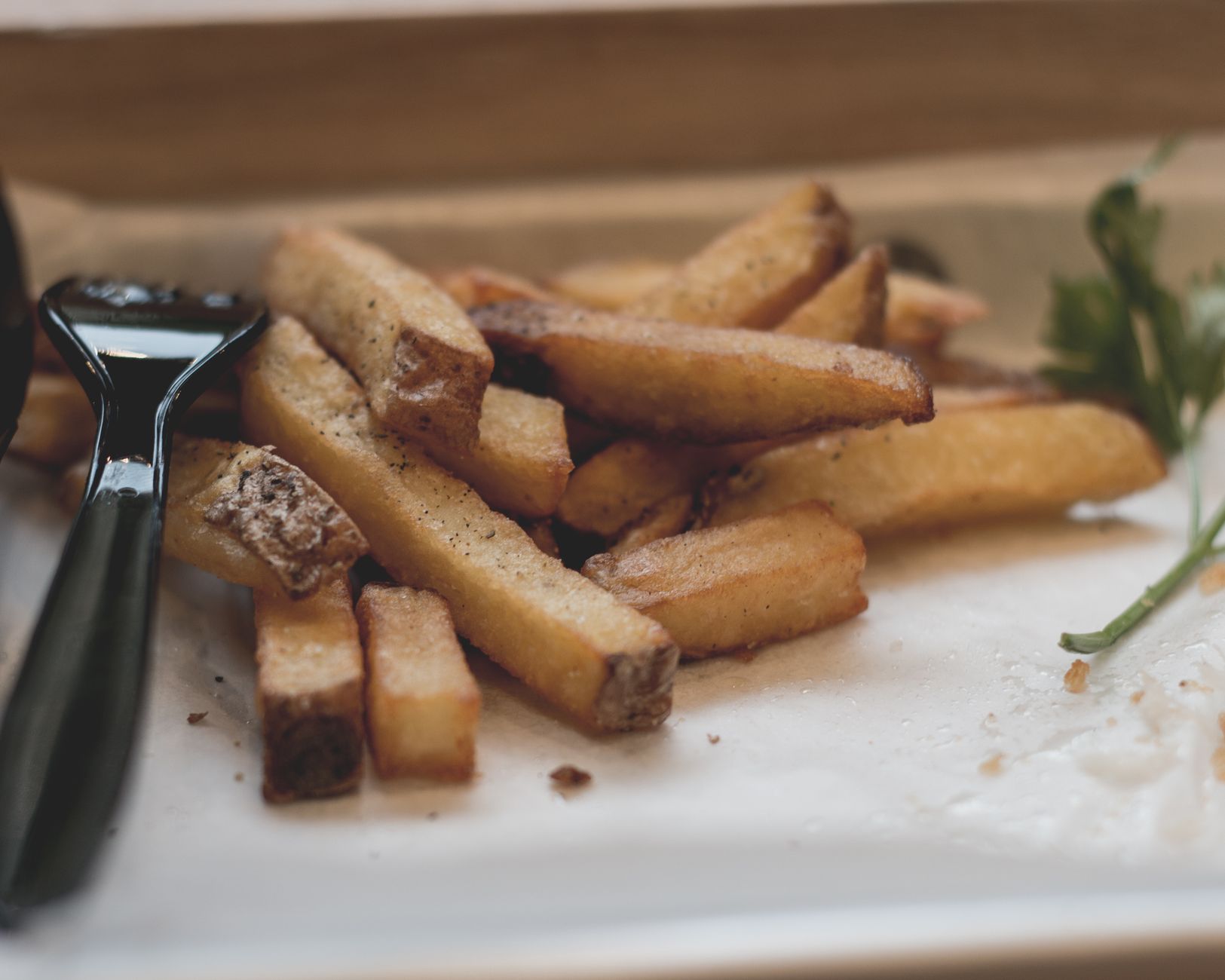 Golden crispy fried potatoes cooking on Blackstone griddle