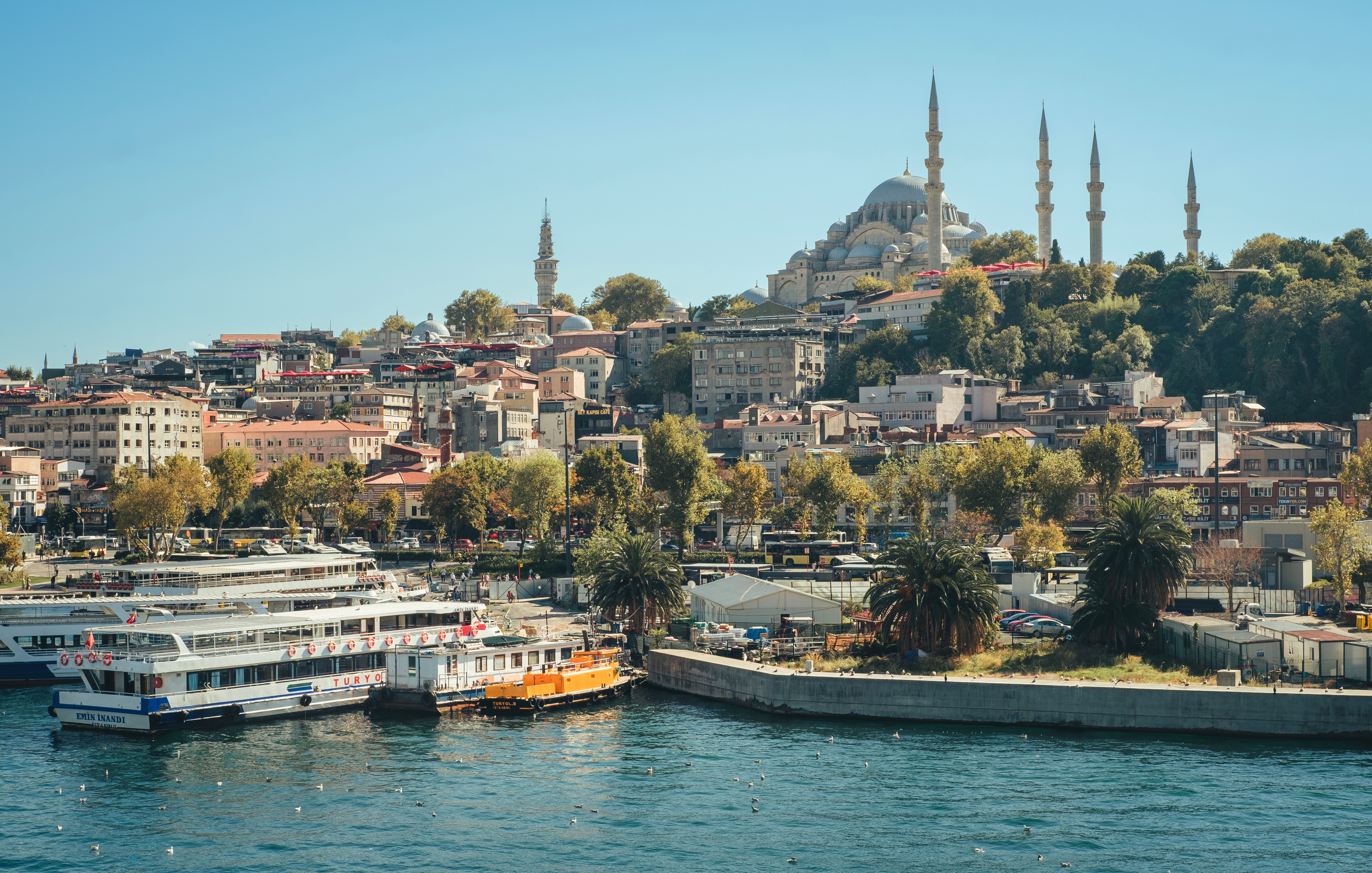Beautiful daytime view of Istanbul featuring the iconic Suleymaniye Mosque and vibrant waterfront.
