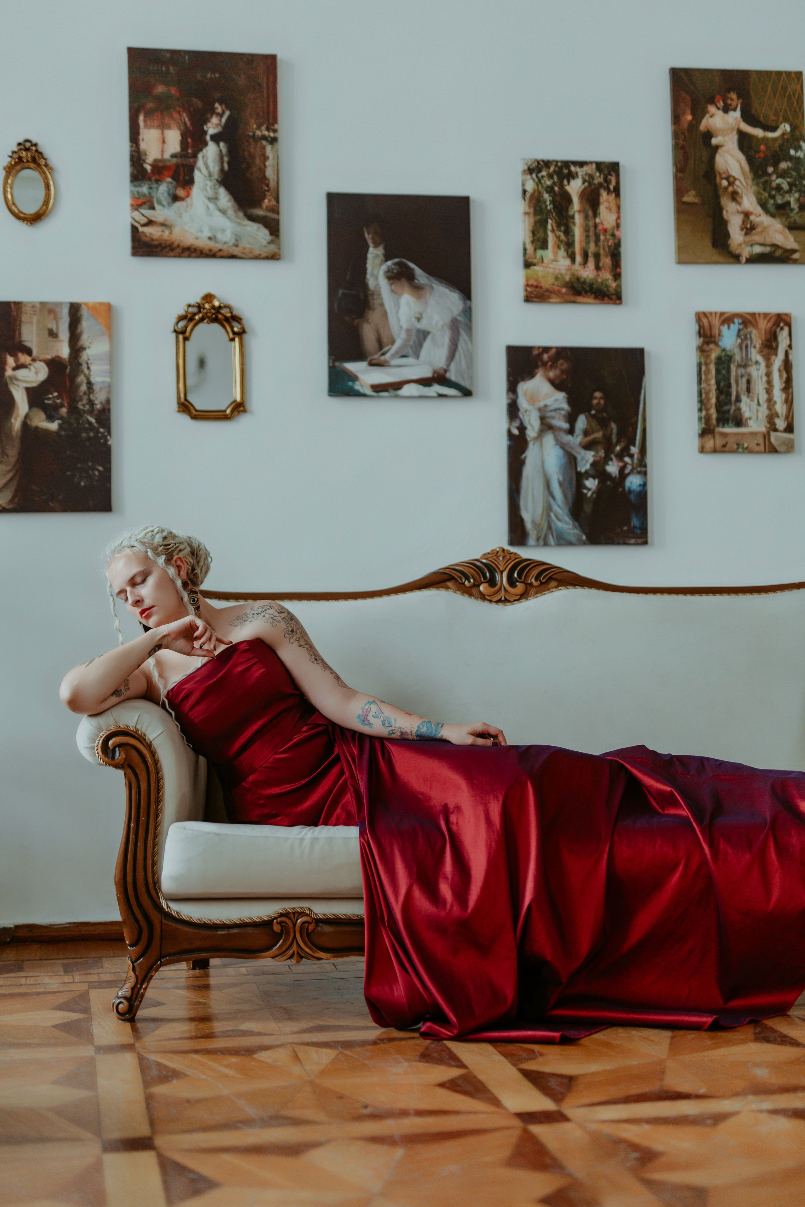 Elegant Woman in Red Dress on Vintage Sofa · Free Stock Photo