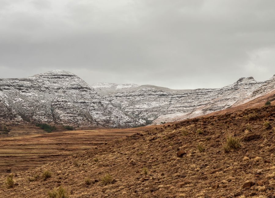 Stunning winter landscape of snow-dusted mountains in Teyateyaneng, Lesotho.