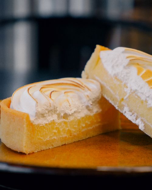 Free Close-up of a lemon meringue pie with whipped topping and golden crust. Stock Photo