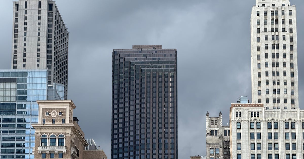 A captivating view of Chicago's skyline showcasing a mix of historic and modern architecture under ominous clouds.