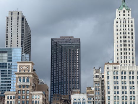 A captivating view of Chicago's skyline showcasing a mix of historic and modern architecture under ominous clouds.