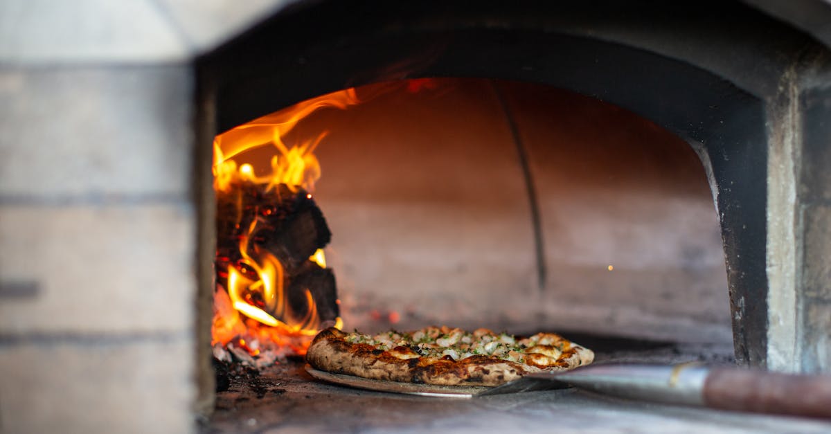 Delicious artisan pizza being baked in a traditional wood-fired oven.
