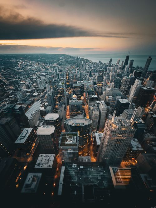 Free A stunning aerial view of Chicago's skyline at twilight, showcasing iconic architecture and city lights. Stock Photo