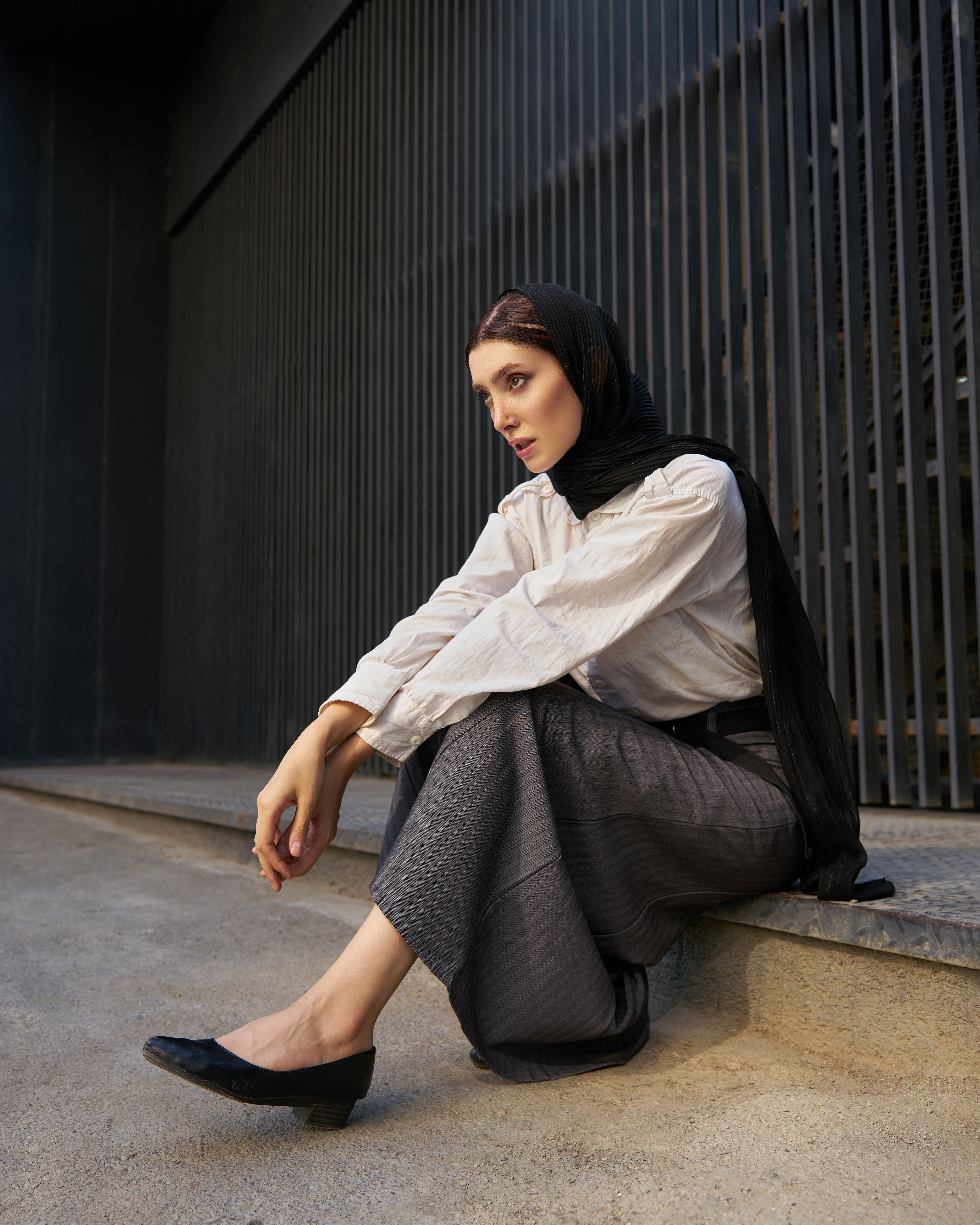 Contemplative woman sitting on urban steps · Free Stock Photo