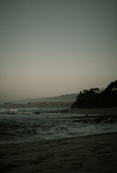 A moody seascape captured at dusk on a beach in Garut, West Java, Indonesia.