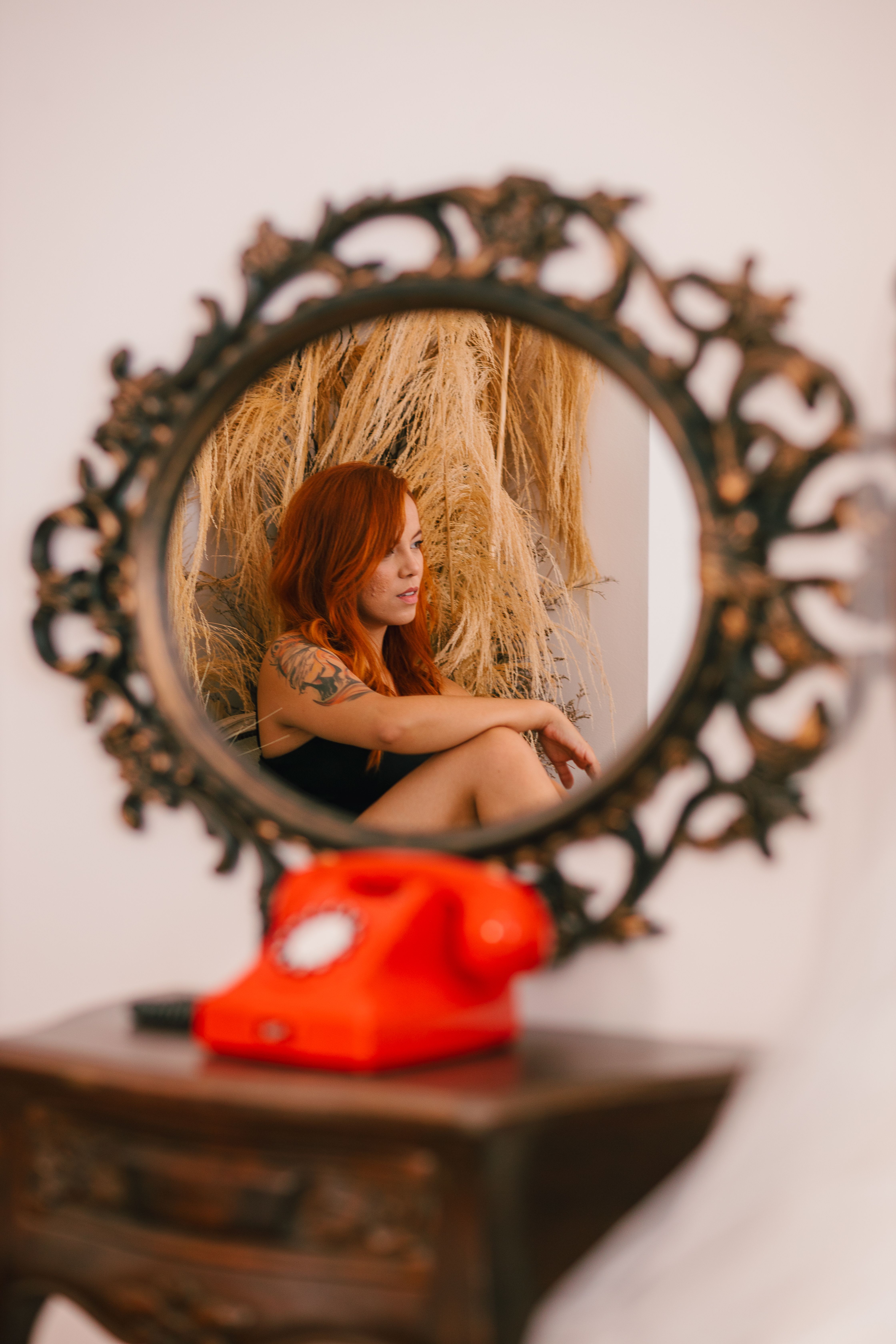 Reflective Portrait of a Woman with Red Hair · Free Stock Photo