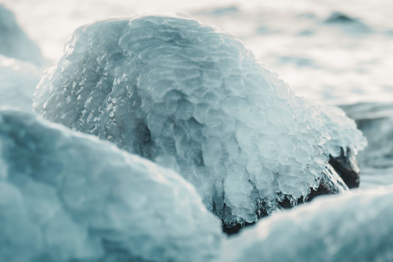 close up of ice covered stones capturing a magical winter atmosphere i
