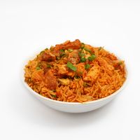 Bowl of spiced rice with chicken and spring onion, photo by Kunal Lakhotia on Pexels