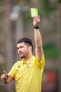 Soccer Referee Showing Card During Match