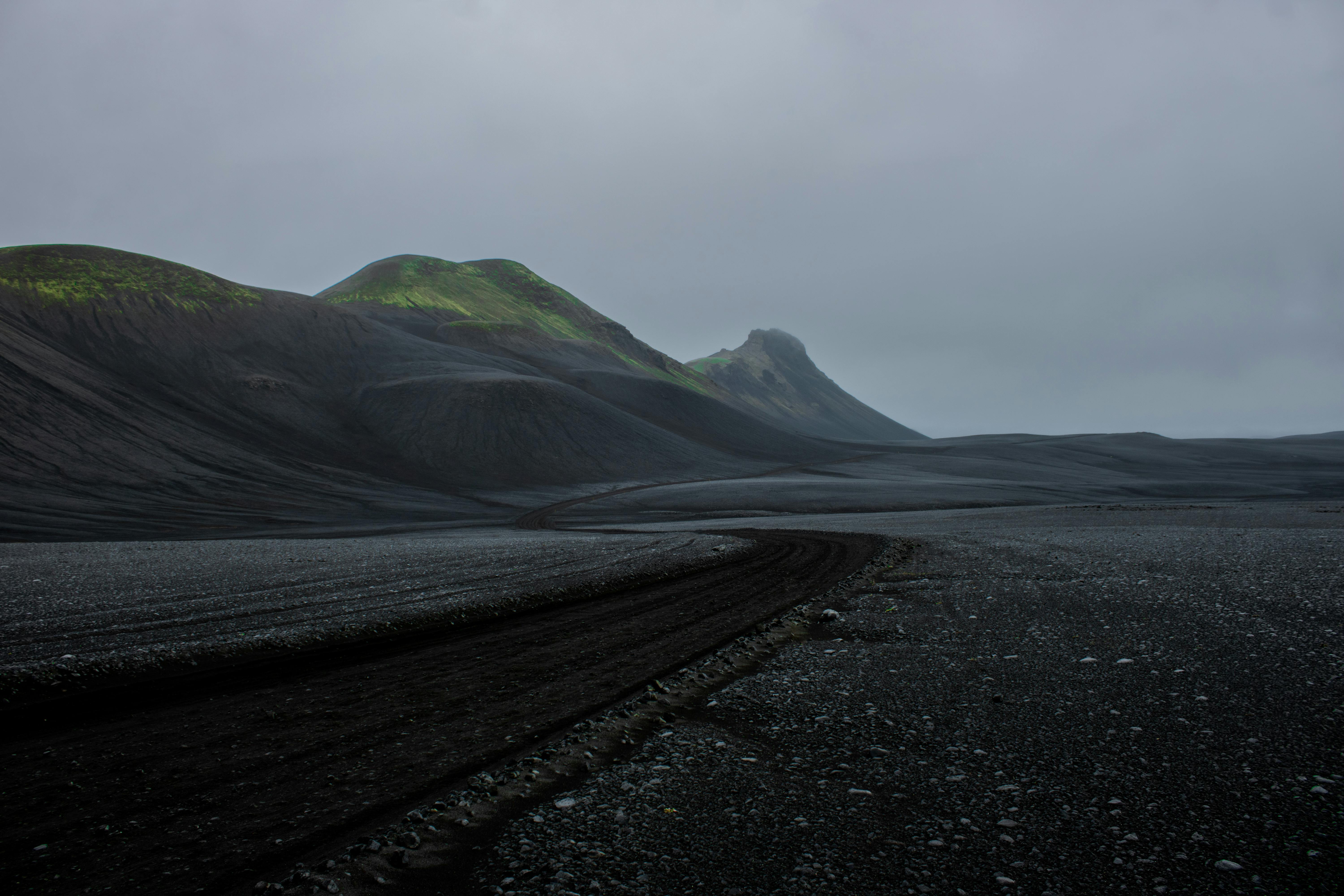 Scenic volcanic landscape in Þingeyjarsveit, Iceland with moody skies.
