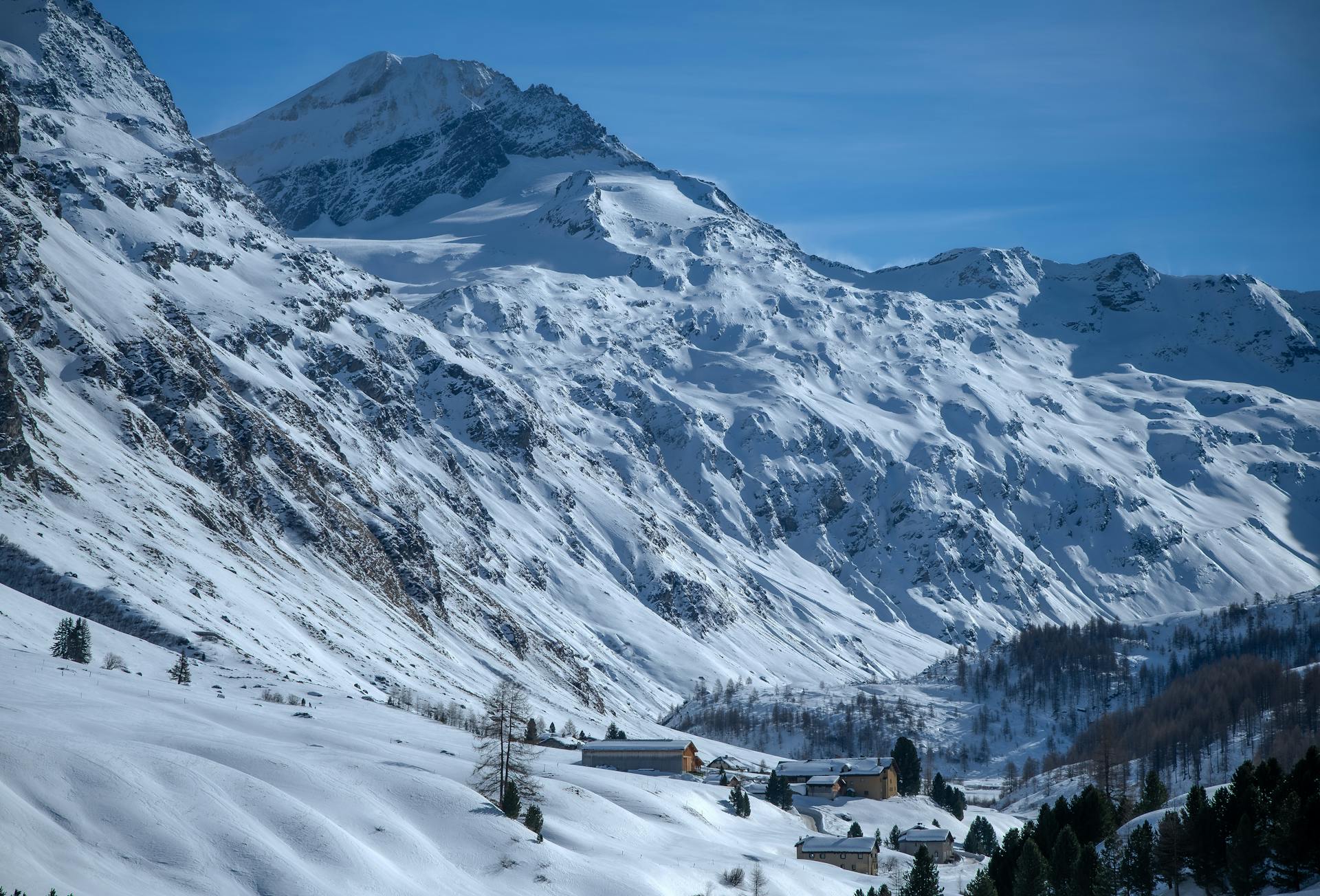 Stunning winter view of the snow-covered Swiss Alps in Sils im Engadin, Grisons, Switzerland.