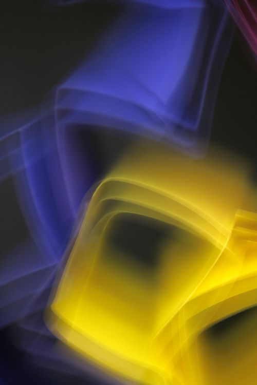 Free Colorful abstract light trails with soft motion blur creating a vibrant artistic effect. Stock Photo
