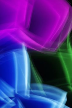 Vivid abstract light patterns in blue, green, and purple shades with dynamic movement.