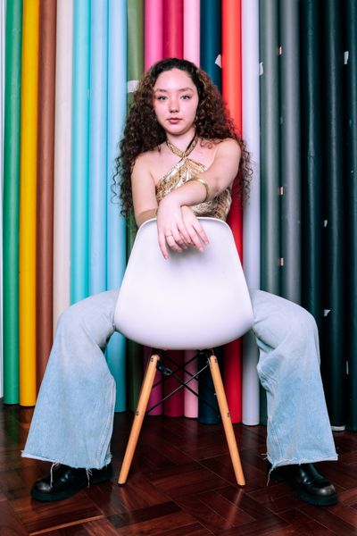 Studio portrait against a colored backdrop — photo by Evandro Paula Alves on Pexels