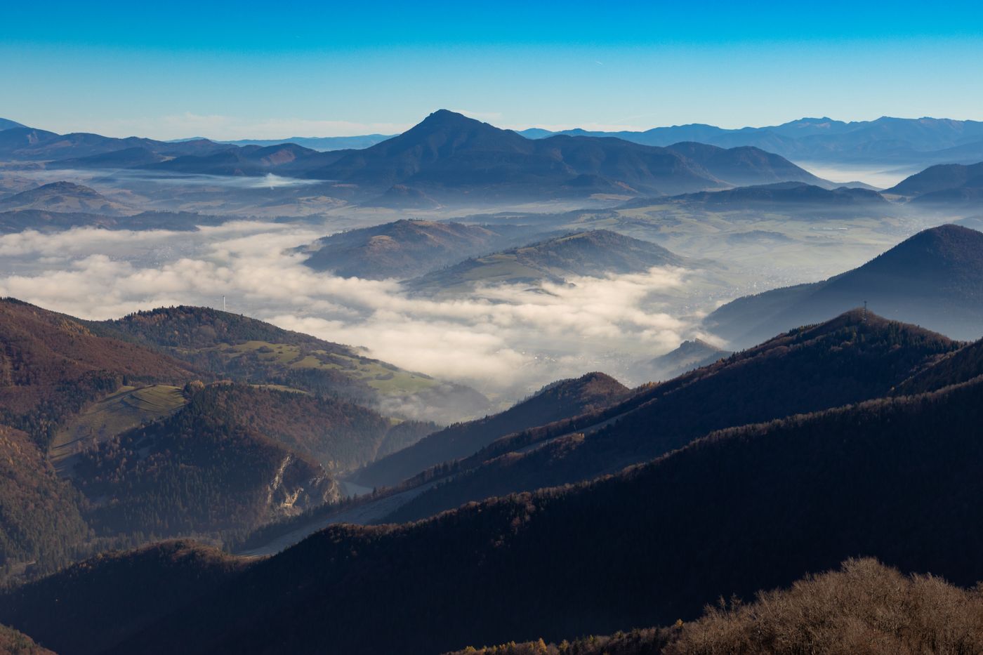 Layered ridgelines under soft cloud, photo by Jan Brndiar on Pexels