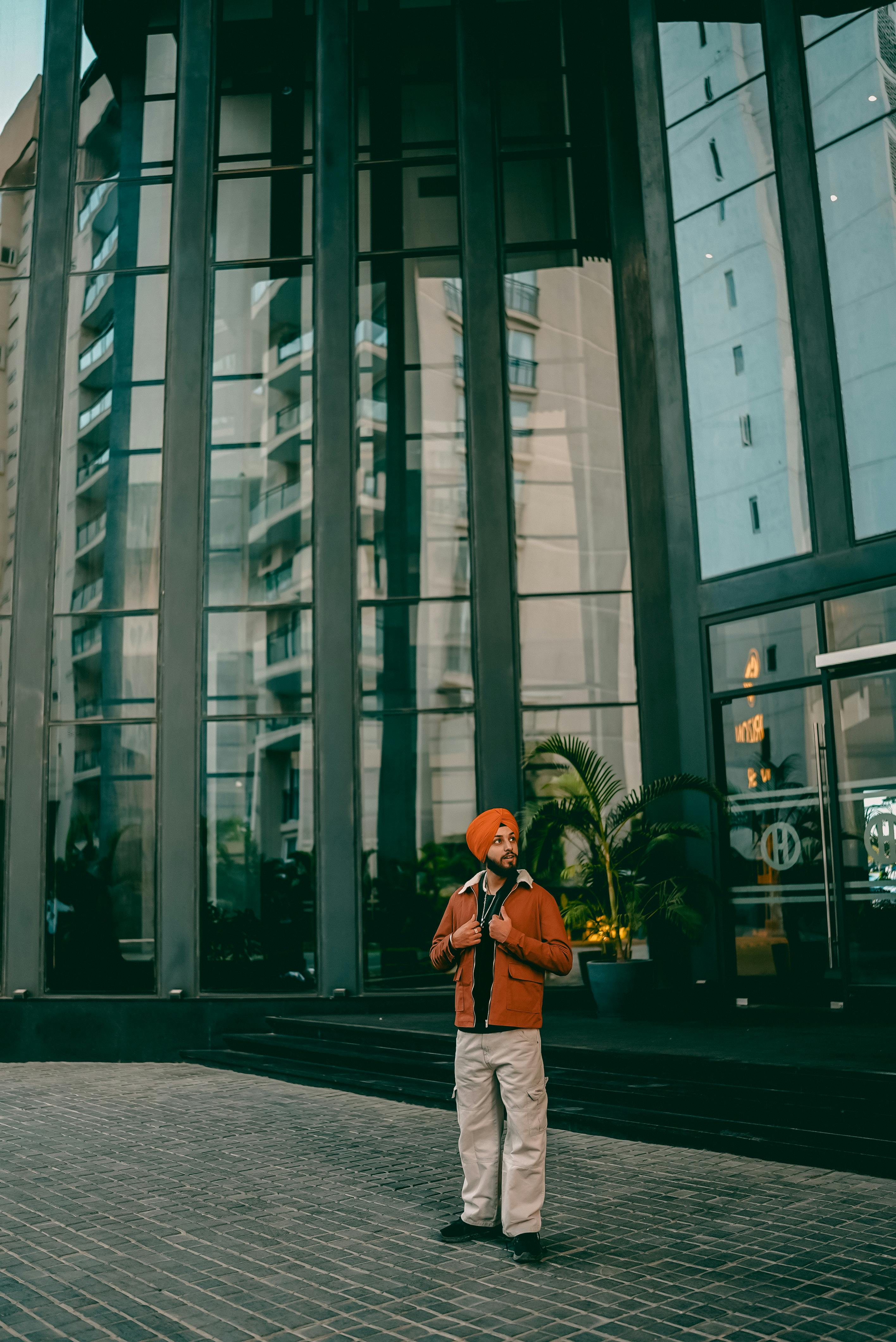 stylish individual in front of modern jaipur building